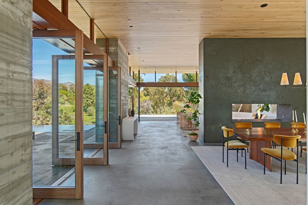 The Contemporary Home in Malibu is a private sanctuary of exceptional tranquility set at the end of a double-gated drive now available for sale. This home located at 6708 Wildlife Rd, Malibu, California; offering 6 bedrooms and 7 bathrooms with over 6,000 square feet of living spaces. 