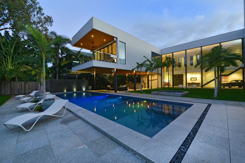 The Queensland Home is a stunning modern masterpiece with contemporary furnishings and bathed in natural light now available for rent. This home located at 50 Kewarra Street, Kewarra Beach, Queensland, Australia; offering 5 bedrooms and 7 bathrooms with over 1,200 square meter of living spaces.