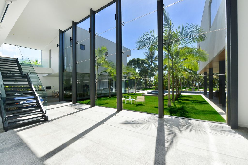 The Queensland Home is a stunning modern masterpiece with contemporary furnishings and bathed in natural light now available for rent. This home located at 50 Kewarra Street, Kewarra Beach, Queensland, Australia; offering 5 bedrooms and 7 bathrooms with over 1,200 square meter of living spaces.