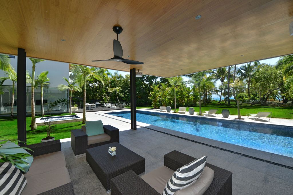 The Queensland Home is a stunning modern masterpiece with contemporary furnishings and bathed in natural light now available for rent. This home located at 50 Kewarra Street, Kewarra Beach, Queensland, Australia; offering 5 bedrooms and 7 bathrooms with over 1,200 square meter of living spaces.