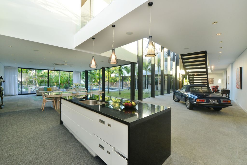 The Queensland Home is a stunning modern masterpiece with contemporary furnishings and bathed in natural light now available for rent. This home located at 50 Kewarra Street, Kewarra Beach, Queensland, Australia; offering 5 bedrooms and 7 bathrooms with over 1,200 square meter of living spaces.