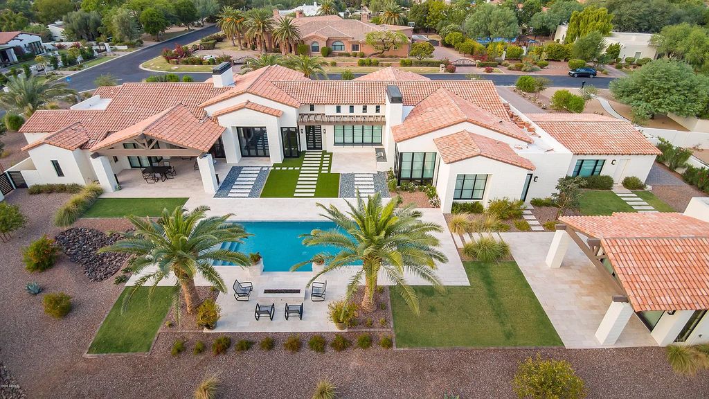 The Modern Hacienda in Coveted Paradise Valley is a luxurious custom home with remarkable quality & workmanship now available for sale. This home located at 5353 E Sanna St, Paradise Valley, Arizona; offering 5 bedrooms and 6 bathrooms with over 6,600 square feet of living spaces.