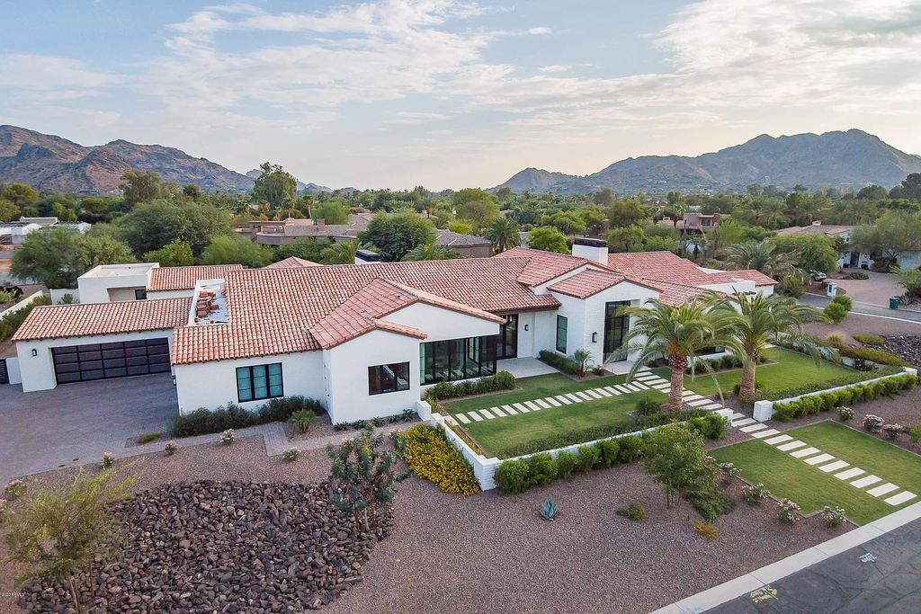 The Modern Hacienda in Coveted Paradise Valley is a luxurious custom home with remarkable quality & workmanship now available for sale. This home located at 5353 E Sanna St, Paradise Valley, Arizona; offering 5 bedrooms and 6 bathrooms with over 6,600 square feet of living spaces.