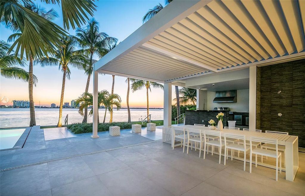 The Modern Mansion in Miami Beach is a stunning new 2-story waterfront estate and adjacent lot featuring resort style living now available for sale. This home located at 1050-1070 S Shore Dr #1070, Miami Beach, Florida; offering 6 bedrooms and 8 bathrooms with over 6,000 square feet of living spaces.