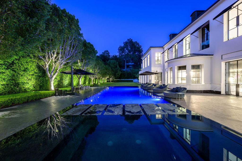 The World Class Trophy Mansion in Los Angeles is a warm contemporary French Manor set in the heart of Old Bel Air now available for sale. This home located at 10701 Bellagio Rd, Los Angeles, California; offering 8 bedrooms and 12 bathrooms with over 24,000 square feet of living spaces.