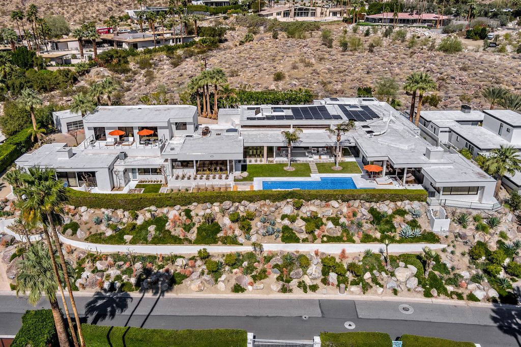 The Palm Springs Hills Modern Home is a iconic estate by John Walling and McCallum with incredible mountain and valley views now available for sale. This home located at 700 W Stevens Rd, Palm Springs, California; offering 6 bedrooms and 8 bathrooms with over 13,000 square feet of living spaces.