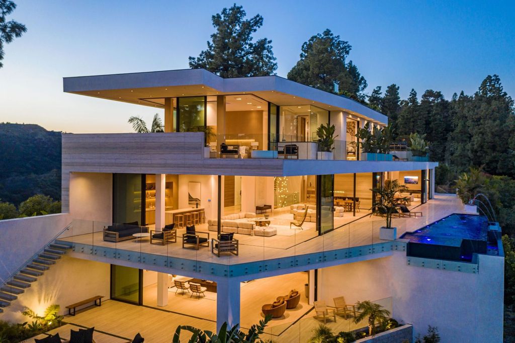 The Beverly Hills Mansion is an organic modern masterpiece set on Located on a picturesque acre featuring automated lifestyle now available for sale. This home located at 1274 Lago Vista Dr, Beverly Hills, California; offering 6 bedrooms and 8 bathrooms with over 13,000 square feet of living spaces.