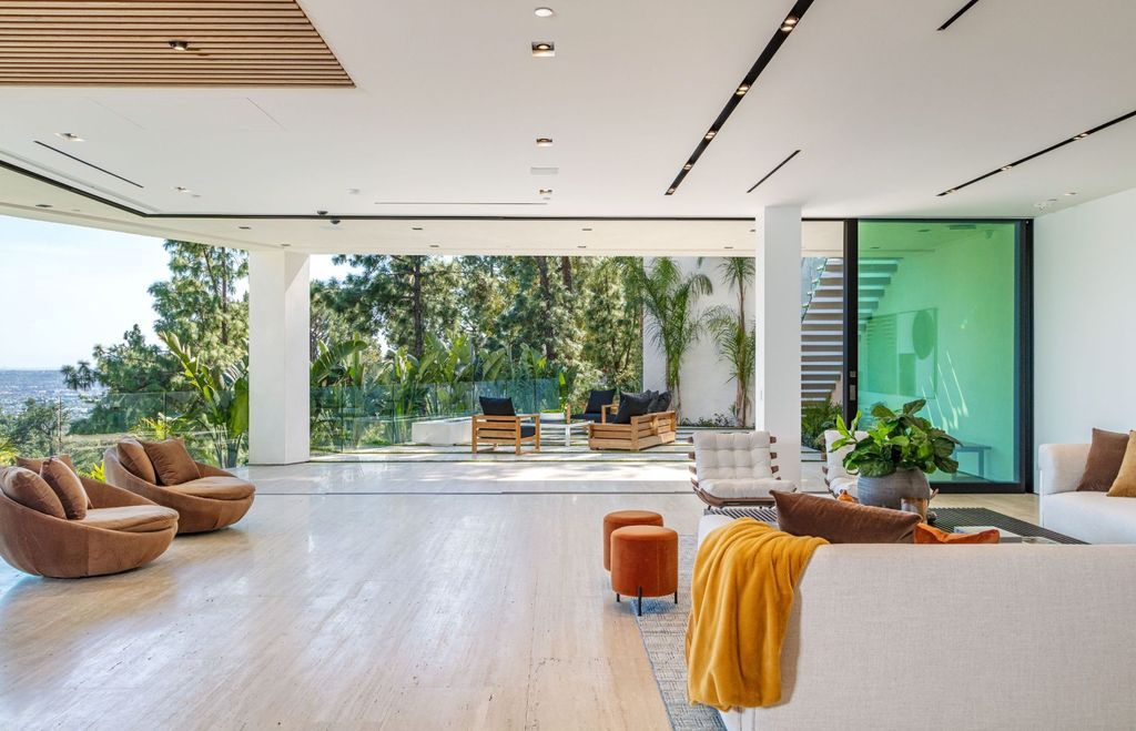 The Beverly Hills Mansion is an organic modern masterpiece set on Located on a picturesque acre featuring automated lifestyle now available for sale. This home located at 1274 Lago Vista Dr, Beverly Hills, California; offering 6 bedrooms and 8 bathrooms with over 13,000 square feet of living spaces.