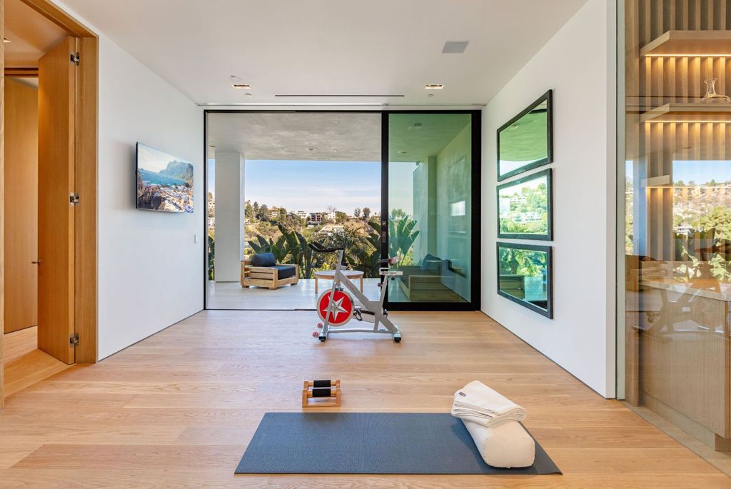 The Beverly Hills Mansion is an organic modern masterpiece set on Located on a picturesque acre featuring automated lifestyle now available for sale. This home located at 1274 Lago Vista Dr, Beverly Hills, California; offering 6 bedrooms and 8 bathrooms with over 13,000 square feet of living spaces.