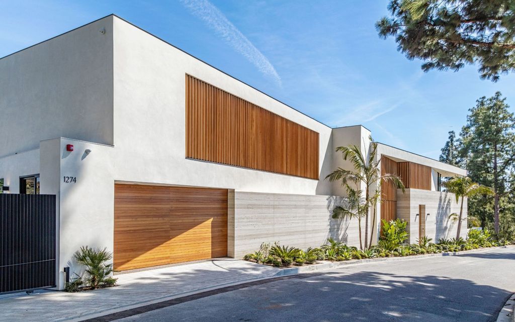 The Beverly Hills Mansion is an organic modern masterpiece set on Located on a picturesque acre featuring automated lifestyle now available for sale. This home located at 1274 Lago Vista Dr, Beverly Hills, California; offering 6 bedrooms and 8 bathrooms with over 13,000 square feet of living spaces.