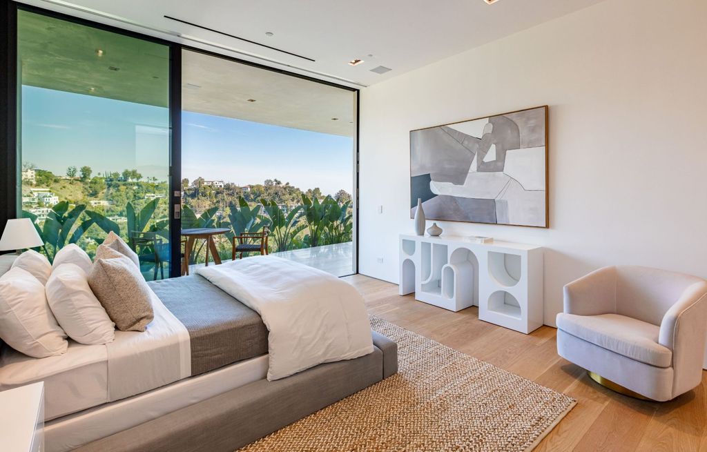 The Beverly Hills Mansion is an organic modern masterpiece set on Located on a picturesque acre featuring automated lifestyle now available for sale. This home located at 1274 Lago Vista Dr, Beverly Hills, California; offering 6 bedrooms and 8 bathrooms with over 13,000 square feet of living spaces.