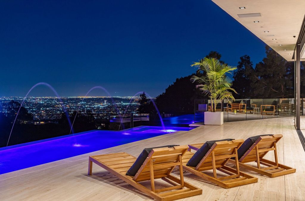 The Beverly Hills Mansion is an organic modern masterpiece set on Located on a picturesque acre featuring automated lifestyle now available for sale. This home located at 1274 Lago Vista Dr, Beverly Hills, California; offering 6 bedrooms and 8 bathrooms with over 13,000 square feet of living spaces.