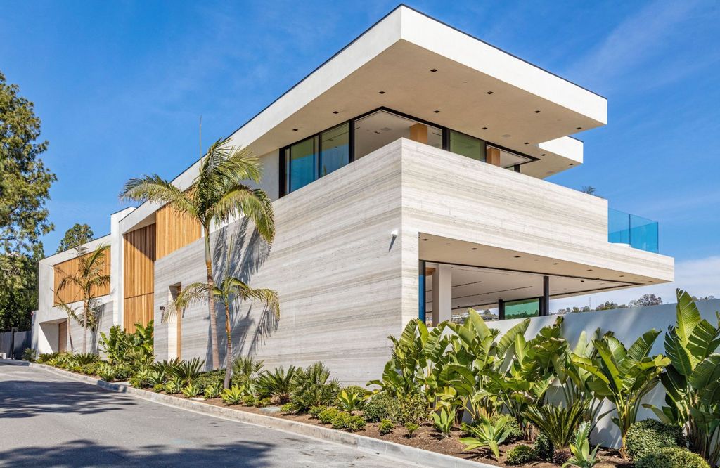 The Beverly Hills Mansion is an organic modern masterpiece set on Located on a picturesque acre featuring automated lifestyle now available for sale. This home located at 1274 Lago Vista Dr, Beverly Hills, California; offering 6 bedrooms and 8 bathrooms with over 13,000 square feet of living spaces.