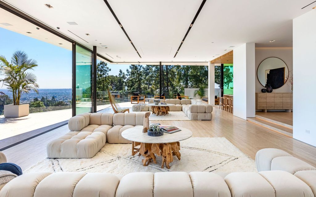 The Beverly Hills Mansion is an organic modern masterpiece set on Located on a picturesque acre featuring automated lifestyle now available for sale. This home located at 1274 Lago Vista Dr, Beverly Hills, California; offering 6 bedrooms and 8 bathrooms with over 13,000 square feet of living spaces.