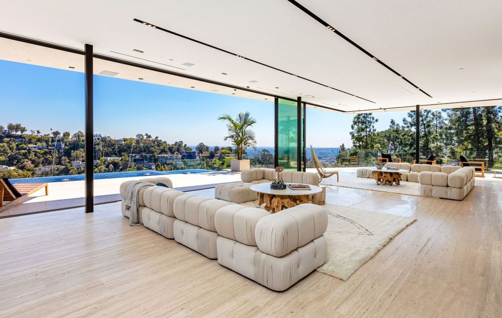 The Beverly Hills Mansion is an organic modern masterpiece set on Located on a picturesque acre featuring automated lifestyle now available for sale. This home located at 1274 Lago Vista Dr, Beverly Hills, California; offering 6 bedrooms and 8 bathrooms with over 13,000 square feet of living spaces.