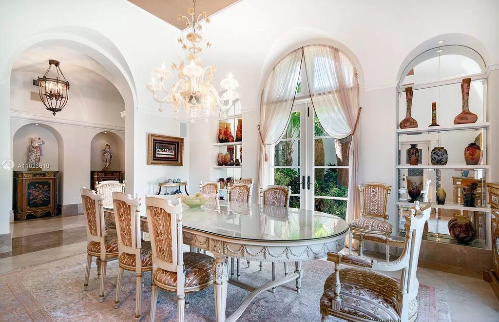 The Mediterranean Waterfront Mansion in Gables Estates is a luxurious home sits on 2.38 acres of lavish landscaping now available for sale. This home located at 8901 Arvida Ln, Coral Gables, Florida; offering 6 bedrooms and 13 bathrooms with over 12,900 square feet of living spaces.