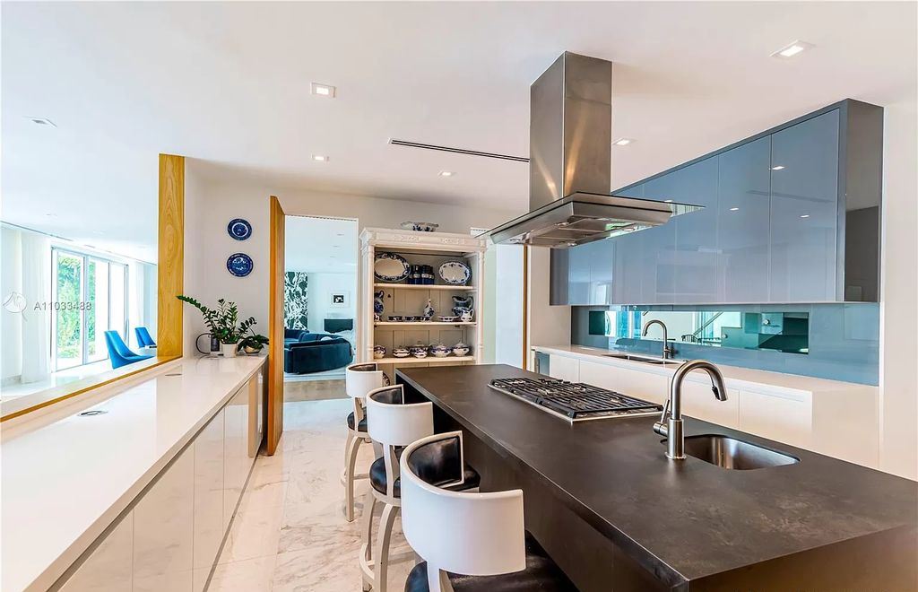 The Modern Waterfront Villa in Miami Beach is a luxurious home on Pine Tree Drive ideal for entertaining now available for sale. This home located at 5711 Pine Tree Dr, Miami Beach, Florida; offering 7 bedrooms and 9 bathrooms with over 8,000 square feet of living spaces.