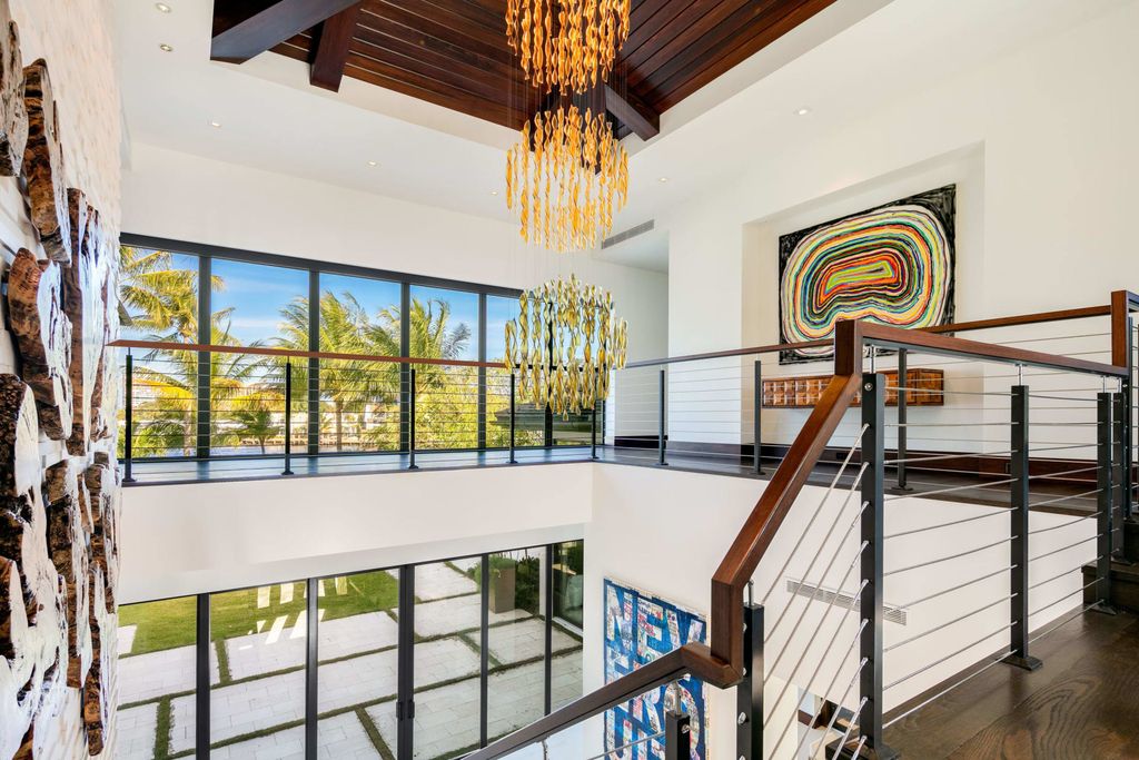 The Contemporary Mansion in Florida is a magnificent Balinese inspired point lot estate overlooking the Intracoastal now available for sale. This home located at 141 Bay Colony Dr, Fort Lauderdale, Florida; offering 6 bedrooms and 9 bathrooms with over 10,000 square feet of living spaces.