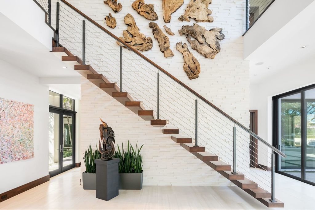 The Contemporary Mansion in Florida is a magnificent Balinese inspired point lot estate overlooking the Intracoastal now available for sale. This home located at 141 Bay Colony Dr, Fort Lauderdale, Florida; offering 6 bedrooms and 9 bathrooms with over 10,000 square feet of living spaces.