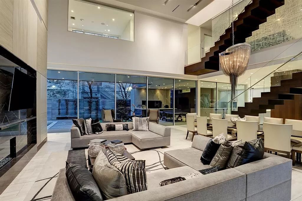 The masterful custom home in Houston offers modern contemporary detail and clean-line architecture mixed with the warmth of modern construction now available for sale. This home located at 4001 Ella Lee Ln, Houston, Texas; offering 4 bedrooms and 6 bathrooms with over 6,300 square feet of living spaces.