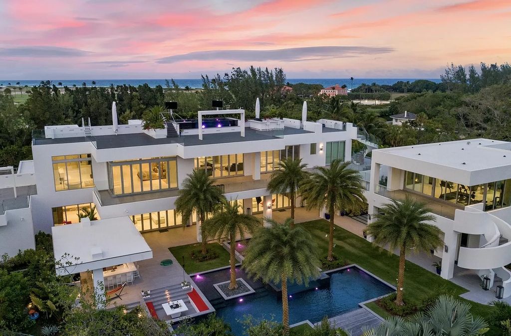 The Florida Contemporary Mansion is a luxurious masterpiece in the highly sought after enclave of Seminole Landing now available for sale. This home located at 1104 Seminole Blvd, North Palm Beach, Florida; offering 7 bedrooms and 8 bathrooms with over 17,000 square feet of living spaces. 