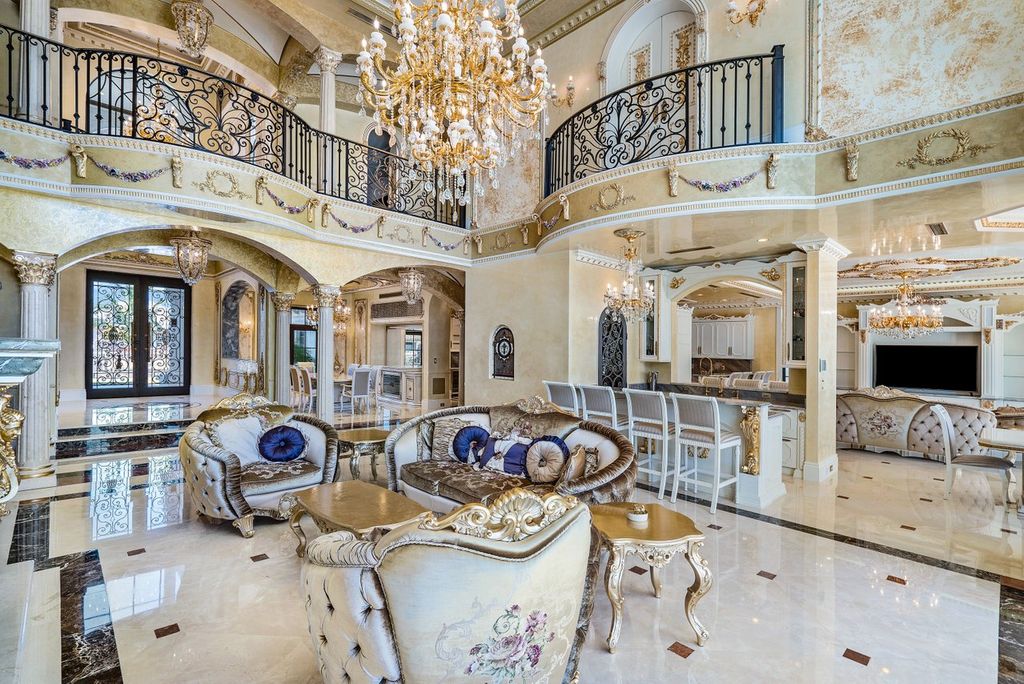 The Florida Mansion designed in Classic Venetian Style with all interior walls and ceilings are artisan crafted venetian plaster with gold leaf inlays now available for sale. This home located at 4200 NE 31st Ave, Lighthouse Point, Florida; offering 7 bedrooms and 9 bathrooms with over 9,000 square feet of living spaces.