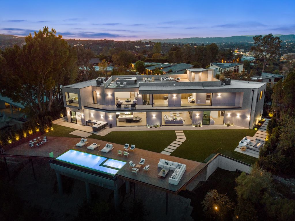 The New Construction Home in Encino is an entertainers paradise awaits with the massive rooftop deck and a sparkling infinity pool now available for sale. This home located at 16110 Meadowview Dr, Encino, California; offering 7 bedrooms and 7 bathrooms with over 10,000 square feet of living spaces.
