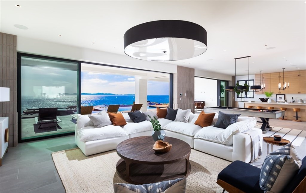 The Dana Point Home is an unparalleled custom estate redefines luxurious seaside living above the mercurial Pacific Ocean now available for sale. This home located at 17 Beach View Ave, Dana Point, California; offering 5 bedrooms and 9 bathrooms with over 8,300 square feet of living spaces.
