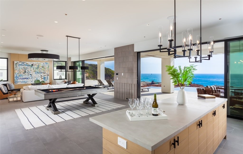 The Dana Point Home is an unparalleled custom estate redefines luxurious seaside living above the mercurial Pacific Ocean now available for sale. This home located at 17 Beach View Ave, Dana Point, California; offering 5 bedrooms and 9 bathrooms with over 8,300 square feet of living spaces.