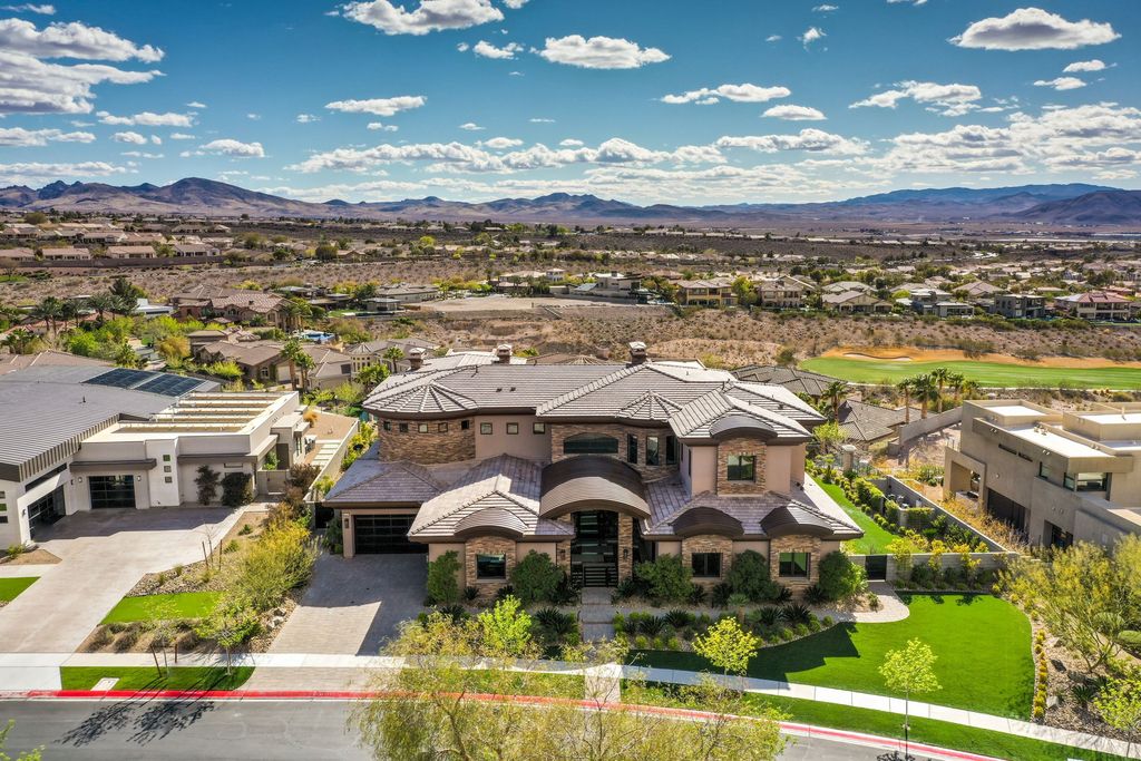 The Henderson Home is a perfect blend of form and functionality which uses a selection of quality finishes for the modern architecture now available for sale. This home located at 1602 Villa Rica Dr, Henderson, Nevada; offering 5 bedrooms and 8 bathrooms with over 8,100 square feet of living spaces.