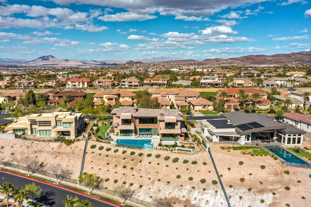 The Henderson Home is a perfect blend of form and functionality which uses a selection of quality finishes for the modern architecture now available for sale. This home located at 1602 Villa Rica Dr, Henderson, Nevada; offering 5 bedrooms and 8 bathrooms with over 8,100 square feet of living spaces.