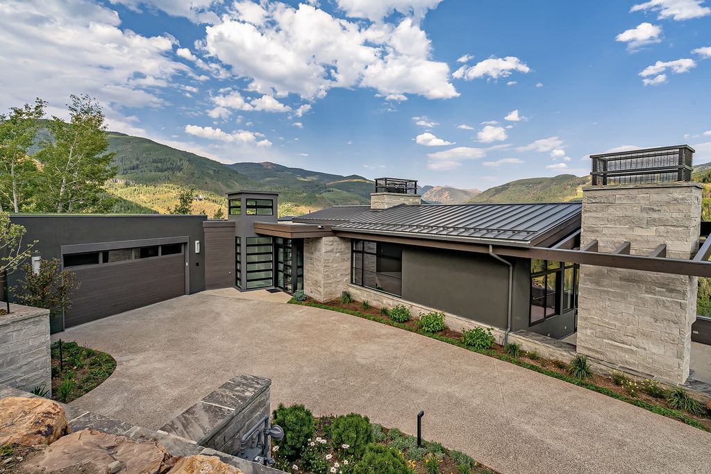 The Vail's Newest Mountain Luxury Home is a mountaintop residence with out of this world elevated views of the Gore Range now available for sale. This home located at 1450 Buffehr Creek Rd, Vail, Colorado; offering 5 bedrooms and 8 bathrooms with over 5,700 square feet of living spaces.