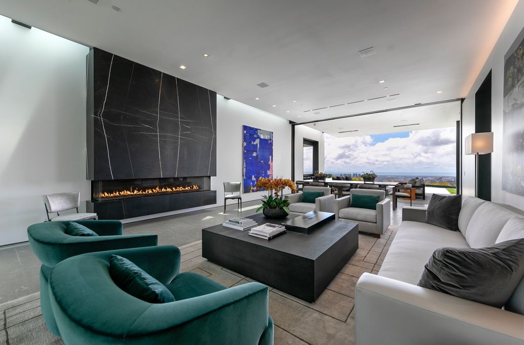 The Mansion in Beverly Hills is a spectacular hillside glass-walled sanctuary with Trousdale Estates most explosive panoramic city to ocean views now available for sale. This home located at 514 Chalette Dr, Beverly Hills, California; offering 6 bedrooms and 11 bathrooms with over 12,000 square feet of living spaces.