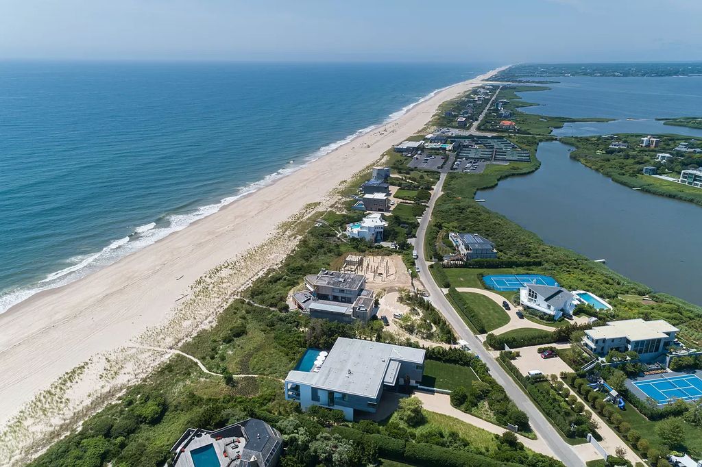 The Oceanfront Mansion in Bridgehampton located in one of the Hamptons most desirable neighborhoods, the home truly has it all now available for sale. This home located at 125 Mid Ocean Dr, Bridgehampton, New York; offering 8 bedrooms and 12 bathrooms with over 10,000 square feet of living spaces.