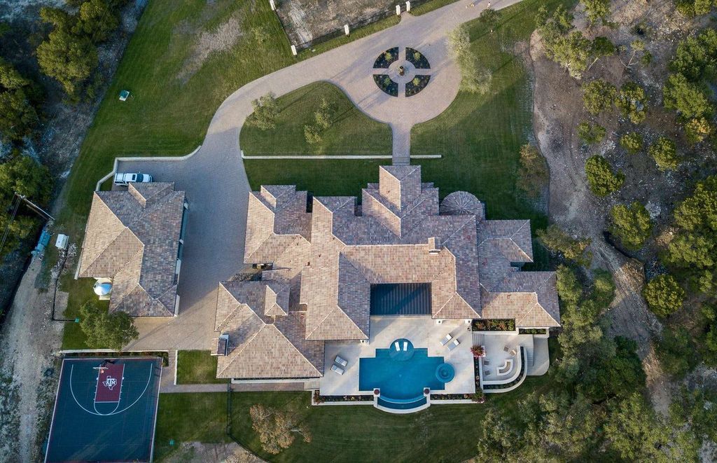 The Texas Waterfront Mansion is a spectacular residence marries quintessential Tuscany with iconic Hill Country flair now available for sale. This home located at 15201 Fm 2769, Volente, Texas