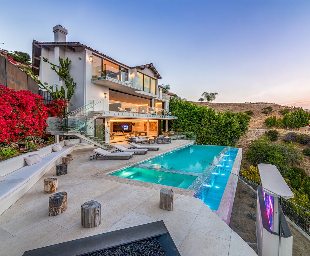 The Contemporary Home in the Hollywood Hills offers spectacular city views, abundant amenities, and a chic Los Angeles lifestyle now available for sale. This home located at 7846 Granito Dr, Los Angeles, California