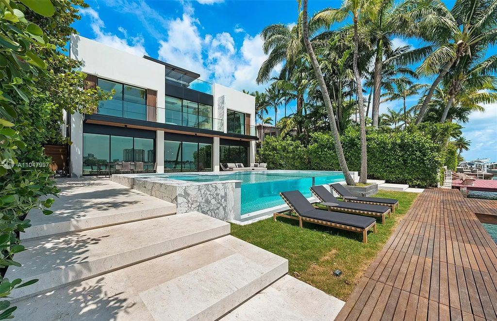 The Modern Waterfront Home in Miami Beach is a luxurious estate with panoramic views of south beach developed and built by Andian Group now available for sale. This home located at 247 E Rivo Alto Dr, Miami Beach, Florida