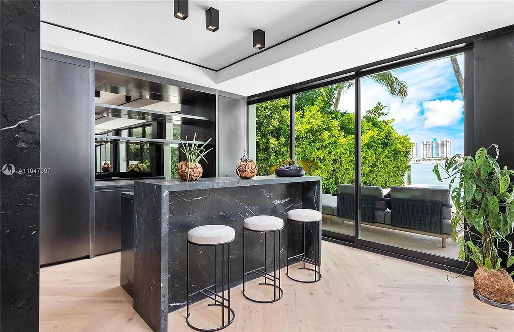 Experiment with rich green tones to add a natural touch to your gloomy kitchen. Consider the combination of forest green cabinets, black marble counters, and brass accents. Introduce indoor plants and herbs to provide freshness and life to the room, resulting in a tranquil and earthy ambiance.