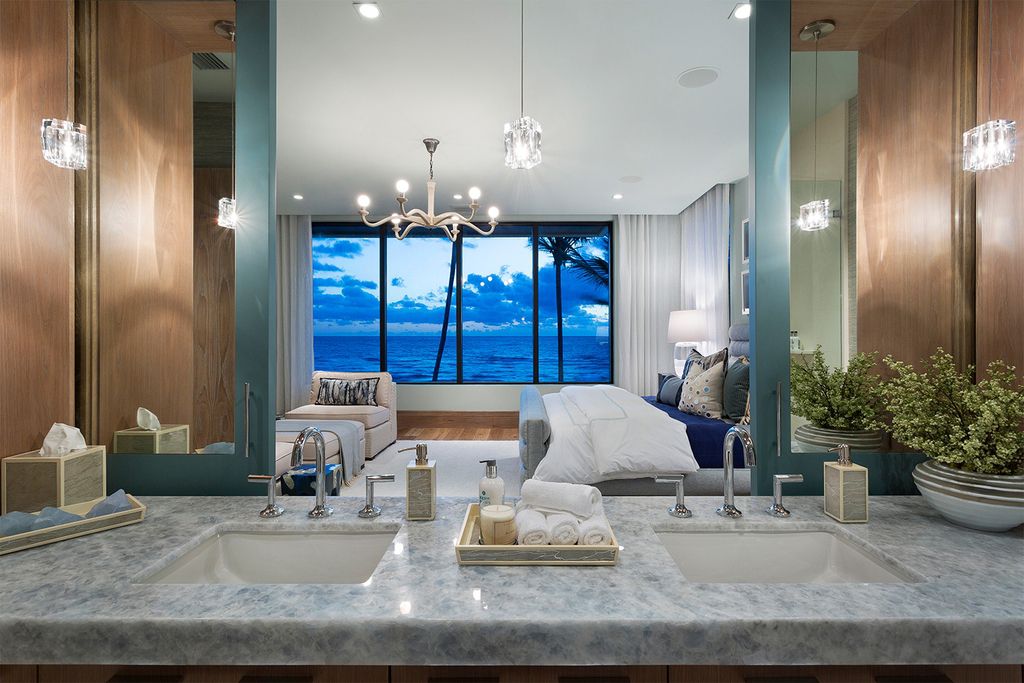 This Oceanfront Home in Florida was built and designed by Mark Timothy Luxury Homes to the creativity of award-winning Affiniti Architects. Direct beachfront on the Atlantic Ocean & Intracoastal Waterway, the villa offers a private yacht dock
