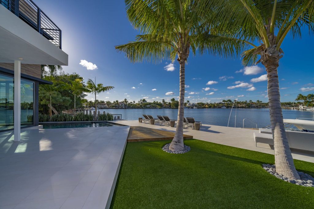 The Fort Lauderdale Home is a beautiful turnkey modern estate located on Sunset Lake with wide water views now available for sale. This home located at 2401 Solar Plaza Dr, Fort Lauderdale, Florida; offering 5 bedrooms and 7 bathrooms with over 5,400 square feet of living spaces.