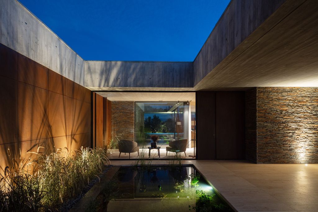 Cork Trees House by Trama Arquitetos, a Raw concrete floats over Horizon