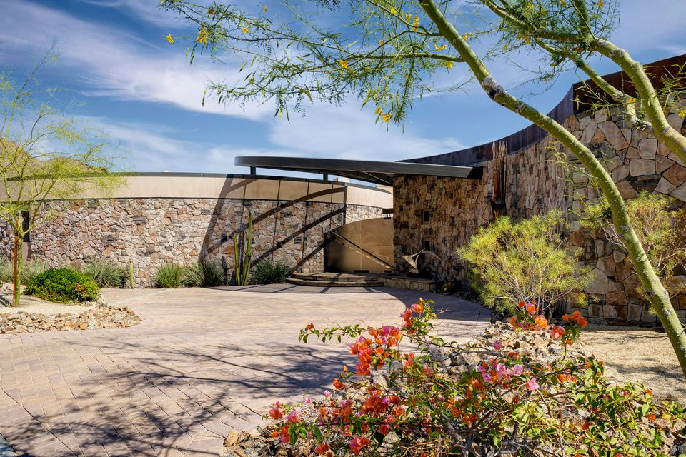 The Home in Palm Desert is an extraordinary architectural and constructional achievement perched high at the top of prestigious Bighorn Golf Club now available for sale. This home located at 124 Tekis Pl, Palm Desert, California