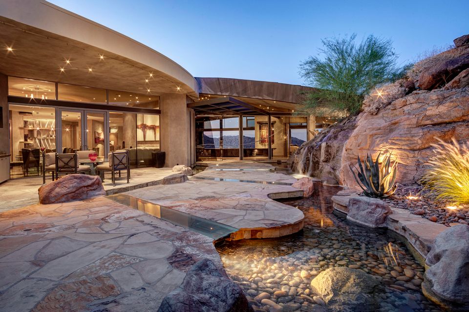 The Home in Palm Desert is an extraordinary architectural and constructional achievement perched high at the top of prestigious Bighorn Golf Club now available for sale. This home located at 124 Tekis Pl, Palm Desert, California