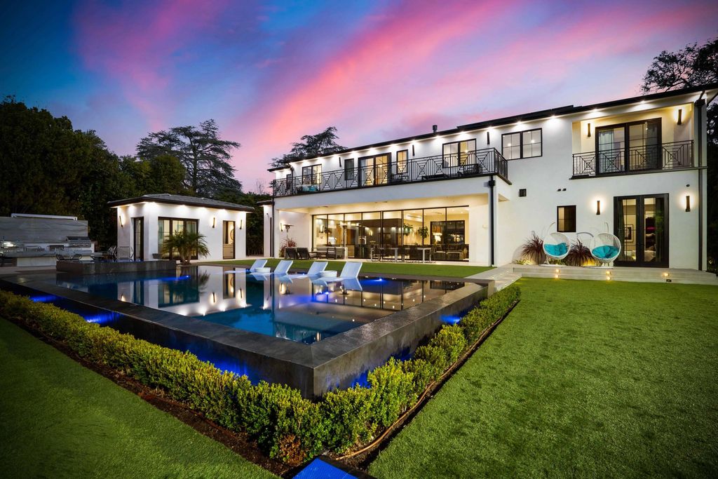The Tarzana Home is a new construction masterpiece sitting on a privately gated featuring a bright, open concept floor plan now available for sale. This home located at 19345 Collier St, Tarzana, California