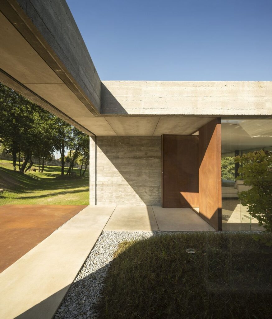Long textured Sambade House in Portugal Countryside by Spaceworkers