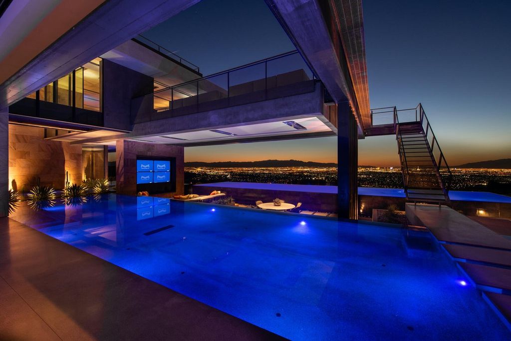 The Iconic Home in Henderson is is a multisensory experience designed to amplify the modern luxury at an unprecedented level now available for sale. This home located at 685 Dragon Peak Dr, Henderson, Nevada