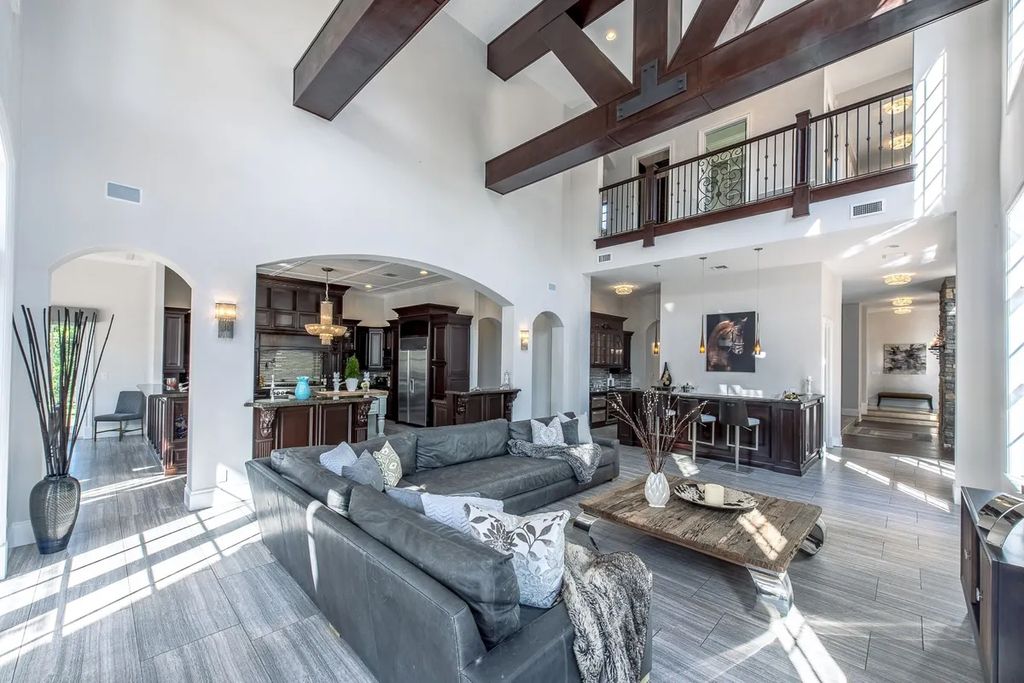 The Home in Parkland is a luxurious home with updates and Smart Home features, including a theater, custom wine cellar, saltwater pool now available for sale. This home located at 9136 NW 66th Ln, Parkland, Flordia; offering 7 bedrooms and 9 bathrooms with over 17,000 square feet of living spaces.