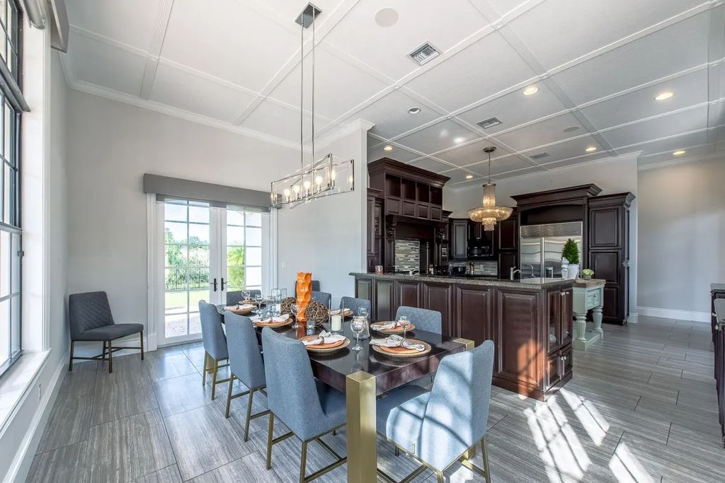 The Home in Parkland is a luxurious home with updates and Smart Home features, including a theater, custom wine cellar, saltwater pool now available for sale. This home located at 9136 NW 66th Ln, Parkland, Flordia; offering 7 bedrooms and 9 bathrooms with over 17,000 square feet of living spaces.