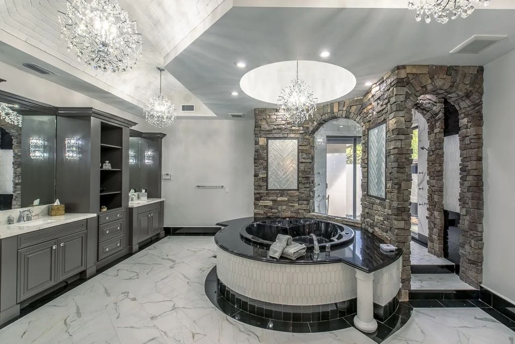 The Home in Parkland is a luxurious home with updates and Smart Home features, including a theater, custom wine cellar, saltwater pool now available for sale. This home located at 9136 NW 66th Ln, Parkland, Flordia; offering 7 bedrooms and 9 bathrooms with over 17,000 square feet of living spaces.