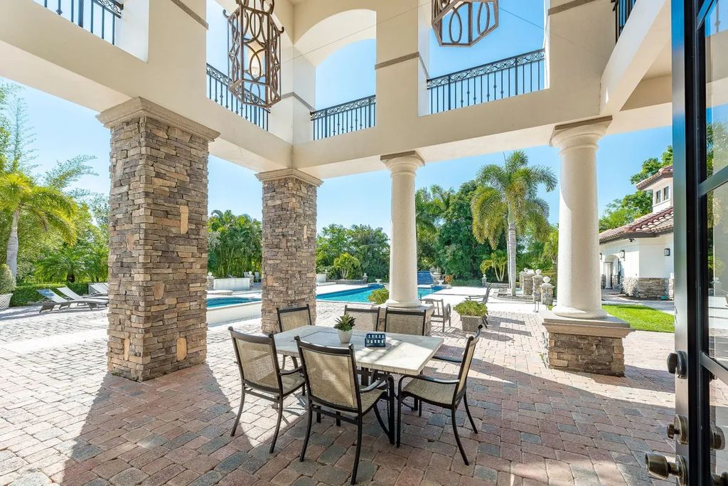 The Home in Parkland is a luxurious home with updates and Smart Home features, including a theater, custom wine cellar, saltwater pool now available for sale. This home located at 9136 NW 66th Ln, Parkland, Flordia; offering 7 bedrooms and 9 bathrooms with over 17,000 square feet of living spaces.